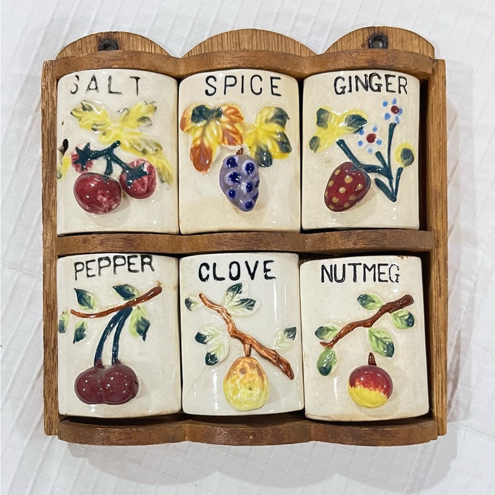 Vintage Ceramic spice containers (6) in wooden case.